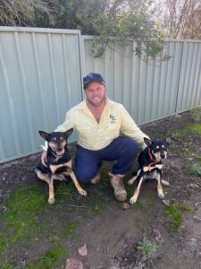 George Evans Hidden Fence distributor with two dogs